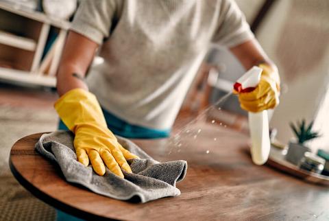 cleaning coffee table in home