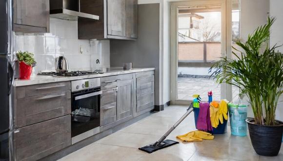 cleaning materials on floor in kitchen